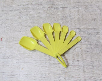 Set of Seven Yellow Tupperware Plastic Measuring Spoons