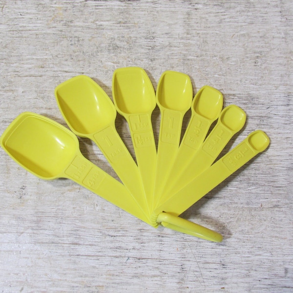 Set of Seven Yellow Tupperware Plastic Measuring Spoons