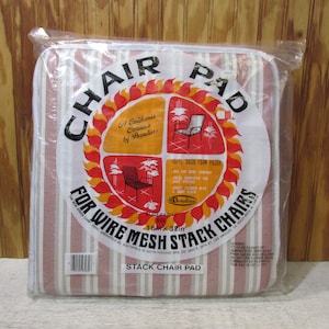 May include: A white and red striped chair pad with the text "Chair Pad" in a red circle with flames. The text "A California Creation by Paradise" is inside the circle. The pad is 16 inches by 32 inches and is for wire mesh stack chairs. The text "Stack Chair Pad" is at the bottom of the pad.