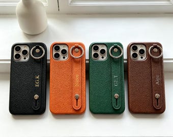 Etui na iPhone'a z niestandardową nazwą i teksturą liczi i uchwytem na nadgarstek