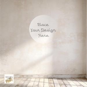 May include: A mockup image showing a textured beige wall and a wooden floor. A white circle with the text "Place Your Design Here" is on the wall. The Golden Lake Mockups logo is in the lower left corner.