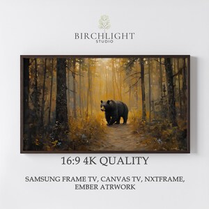 Könnte beinhalten: Ein gerahmtes Kunstwerk zeigt einen schwarzen Bären, der auf einem Pfad durch einen goldfarbenen Wald geht. Das Gemälde hat eine warme Farbpalette mit dem Text "BIRCHLIGHT STUDIO" oben und "16:9 4K QUALITY" unten. Geeignet für Samsung Frame TV, Canvas TV, NXTFRAME und EMBER ATRWORK.