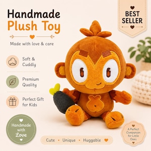 May include: A handmade plush toy monkey in shades of orange and brown, holding a small, dark gray object with yellow accents. The toy has large, round eyes and the text "Handmade Plush Toy" is visible.