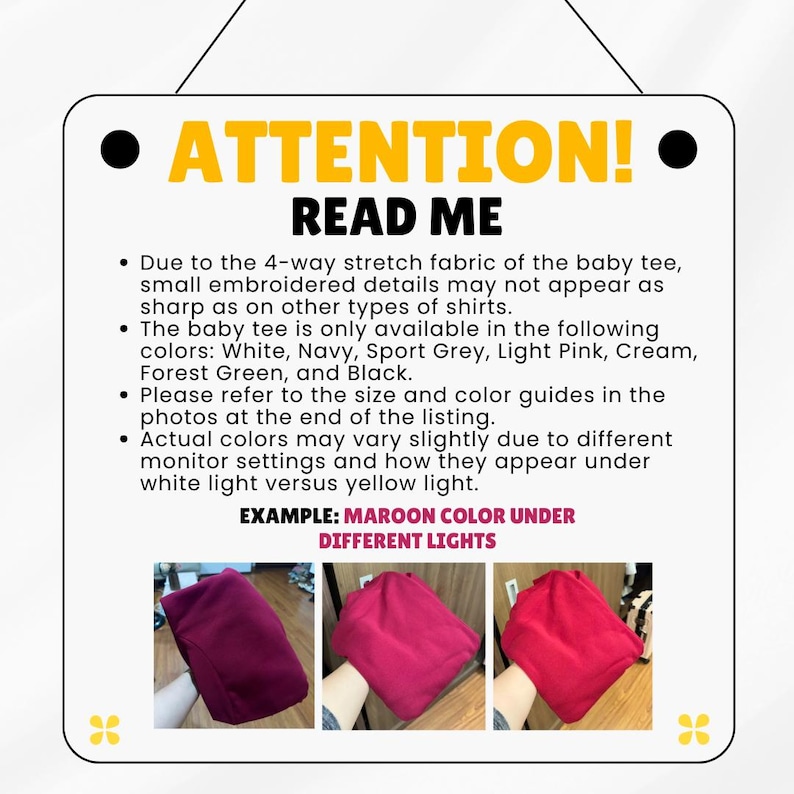 May include: A white sign with the words "ATTENTION! READ ME" in yellow and black. The sign provides details about a baby tee, including color availability: White, Navy, Sport Grey, Light Pink, Cream, Forest Green, and Black.