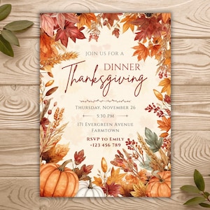May include: A Thanksgiving dinner invitation card featuring a watercolor border of autumn leaves, wheat, and pumpkins. The text reads: JOIN US FOR A DINNER Thanksgiving, THURSDAY, NOVEMBER 26, 5:30 PM, 171 EVERGREEN AVENUE, FARMTOWN, RSVP TO EMILY +123 456 789.