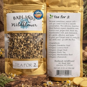 May include: Two gold foil pouches of Badlands Wildflower tea. One pouch displays the brand name and the text "TEA FOR 2". The other pouch lists ingredients like dandelion root and chamomile. The net weight is 0.92 oz (26.2g).