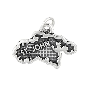 May include: Silver charm shaped like the island of St. John, with the name "ST. JOHN" inscribed on the island.