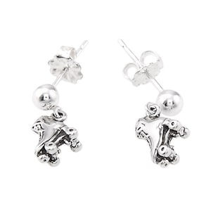 May include: A pair of silver roller skate earrings. Each earring features a small silver ball and a detailed roller skate charm.