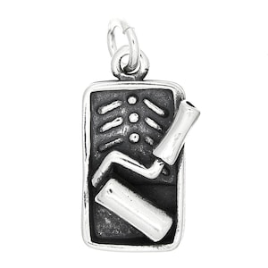 May include: Silver charm pendant featuring a skeleton with a paint roller, a whimsical and quirky design.