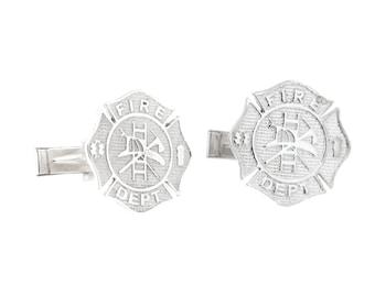 May include: A pair of silver cufflinks featuring a fire department emblem with the words "FIRE DEPT" and a firefighter's axe, ladder, and helmet.