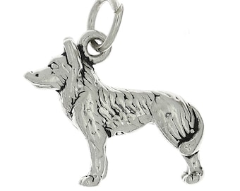 May include: A silver charm in the shape of a standing wolf. The charm has a detailed design and a loop for attaching to a bracelet or necklace.