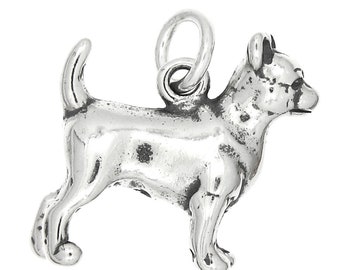 May include: A silver charm in the shape of a Chihuahua dog. The charm has a loop at the top for attaching to a bracelet or necklace.