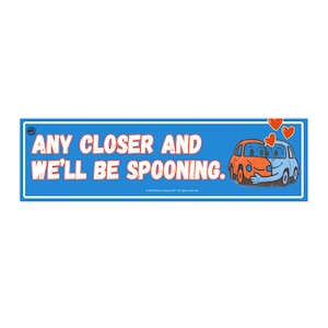 May include: A blue bumper sticker with white text reading "ANY CLOSER AND WE'LL BE SPOONING." Two cartoon cars are embracing, with red hearts above them. The sticker has a white border.