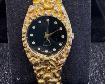 Vintage quartz dameshorloge met goudklompjes