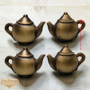 May include: A set of three ceramic mugs with a speckled, matte finish in cream, light grey, and dark grey. Each mug has a simple, minimalist design and a rounded handle.