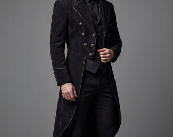 May include: A black long-length coat featuring a double-breasted front with metallic buttons, a structured collar, and long sleeves. The coat is worn over a black vest, a black button-down shirt, black trousers, and black leather dress shoes.