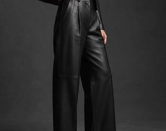 May include: High-waisted black trousers featuring a wide-leg silhouette, front pleats, and side pockets. The trousers are constructed with a smooth finish and a structured waistband with belt loops, paired with a matching black jacket and black boots.