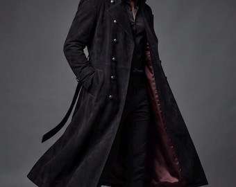 May include: A long black suede trench coat featuring a double-breasted front with metallic buttons, a high collar, and a deep burgundy satin lining. The coat includes a matching belt and long sleeves, extending to the mid-calf in a structured silhouette.