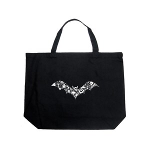 May include: Black tote bag with a white bat design. The bat is made up of smaller Halloween-themed images.