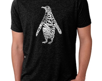 May include: Dark grey t-shirt with a white penguin design made up of different penguin species names. The penguin graphic is in the centre of the shirt. The shirt is made of a dark, textured fabric.