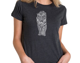 May include: Dark gray t-shirt featuring a white tiger design. The tiger is depicted in a detailed, artistic style, with the image covering the front of the shirt. The shirt has short sleeves and a crew neck.