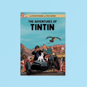 May include: A movie poster for The Adventures of Tintin featuring Tintin, Captain Haddock, and Snowy riding a motorcycle with a sidecar. The text reads From Steven Spielberg and Peter Jackson, The Adventures of Tintin, set against a desert town.