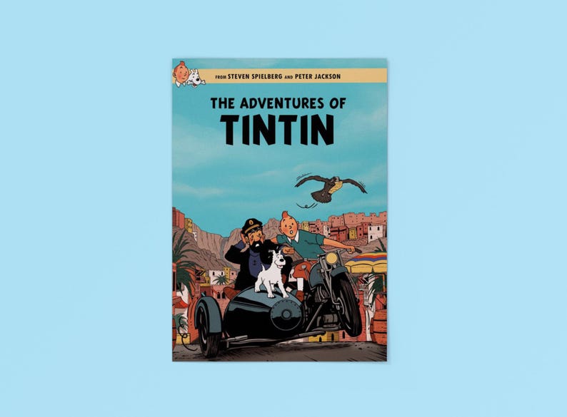 May include: A movie poster for The Adventures of Tintin featuring Tintin, Captain Haddock, and Snowy riding a motorcycle with a sidecar. The text reads From Steven Spielberg and Peter Jackson, The Adventures of Tintin, set against a desert town.