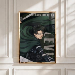 May include: Framed artwork featuring an anime character from "Attack on Titan." The character is depicted with dark hair, wearing a green cloak and black uniform, holding a blade. The artwork has the text "ATTACK ON TITAN" and "LEVI" in white.