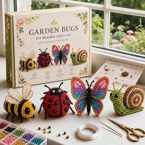 May include: A Garden Bugs DIY beaded craft kit box featuring illustrations of a bee, ladybug, butterfly, and snail. The set includes finished beaded figures, a step-by-step guide, a clear plastic bead organizer, a spool of wire, and two needles.