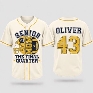 May include: A cream-colored baseball jersey with yellow trim. The front features a football helmet, a football, and the text "SENIOR MOM THE FINAL QUARTER". The back displays the name "OLIVER" in navy blue and the number "43" in yellow with navy outlines.