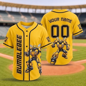 May include: A yellow baseball jersey with black trim, featuring the text BUMBLEBEE vertically on the front, a graphic of a yellow robot, and the text YOUR NAME with the number 00 on the back. The sleeves display a black and yellow robot emblem.
