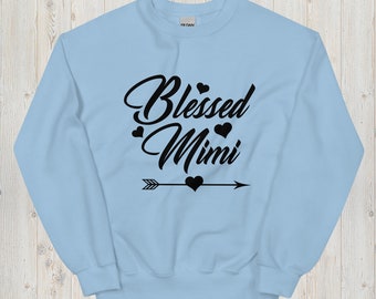 May include: Light blue sweatshirt with black text that reads "Blessed Mimi" with a black arrow and hearts.