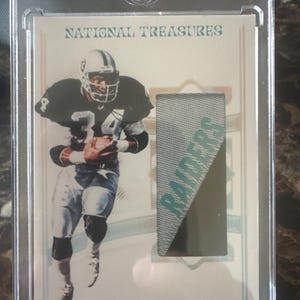 May include: A set of three ceramic nesting bowls in shades of blue, green, and white. The bowls feature a speckled glaze and a simple, modern design. The largest bowl measures approximately 8 inches in diameter.