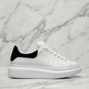 May include: A distressed white wooden sign, inscribed with "Welcome" in a handwritten font. The sign has a rustic aesthetic, with a floral design. Suitable for indoor or outdoor use, it adds a welcoming touch.