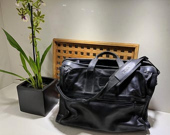 TUMI Black Leather Briefcase with Padded Laptop Insert, Dual Compartments, Multiple Pockets