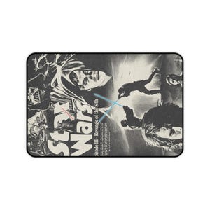 May include: Rectangular mousepad featuring a black and white Star Wars movie poster design. The poster includes images of characters and the text "Star Wars Episode III - Revenge of the Sith". The mousepad has a black border.