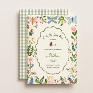 May include: A cream-colored birthday invitation card featuring a scalloped green border, illustrations of colorful insects and flowers, and the text: A Little Love Bug IS TURNING one PLEASE JOIN US TO CELEBRATE Olivia's first birthday JULY 22, 2026 1:30 PM 123 ANYWHERE ST., ANY CITY RSVP +123-456-7890.