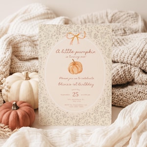 May include: A rectangular birthday invitation card featuring a beige background with a delicate brown floral line art pattern. The center displays a light pink oval containing a watercolor pumpkin illustration, a bow, and text reading A little pumpkin is turning one! Olivia's 1st Birthday, September 25 at 4:00 pm, 123 Anywhere St., Any city, RSVP by September 1st, 123-456-7890.