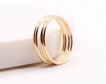 Minimalist gold stacking ring. Smooth gold filled bands to stack. Ultra thin stackable rings layer sold individually or in sets