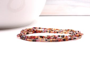 Beaded multi wrap bracelet strung on resilient elastic cord. Raspberry Sundae. Can be worn as a bracelet, anklet or necklace.
