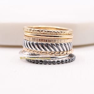 Mixed metal stacking rings in sterling silver and 14k gold filled. Sold individually or the whole stack of 7