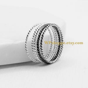 Simple twisted stacking rings available in 3 finishes. Sold individually.