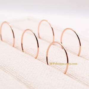 Dainty rose gold smooth ring for stacking. Made using 14k rose gold filled. Mix and match stacking bands for a bohemian look.