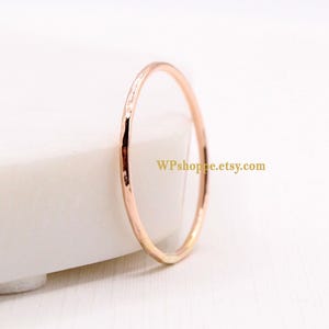 Ultra thin 14K rose gold filled stacking ring. Simple hammered band. Delicate rose gold ring. Dainty stacker ring.