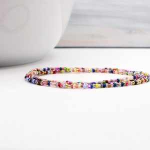 Mystic Shores beaded wrap bracelet. Multi color tiny beads strung on stretch cord that can be worn as a bracelet, anklet or necklace.