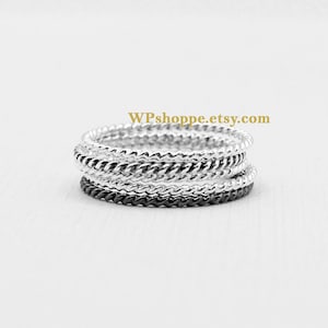 Twisted silver layering band. Sold individually. Sterling stacking rings.