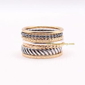 Set of 7 mixed metal stacking rings. Striking ring stack of sterling silver and gold filled bands.