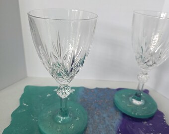 Wine glasses with attached coasters and a matching tray.