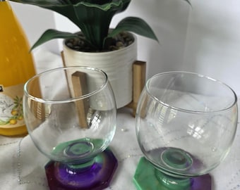 Wine glass with attached coaster