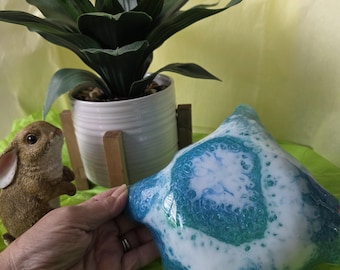 Teal and white resin bowl.